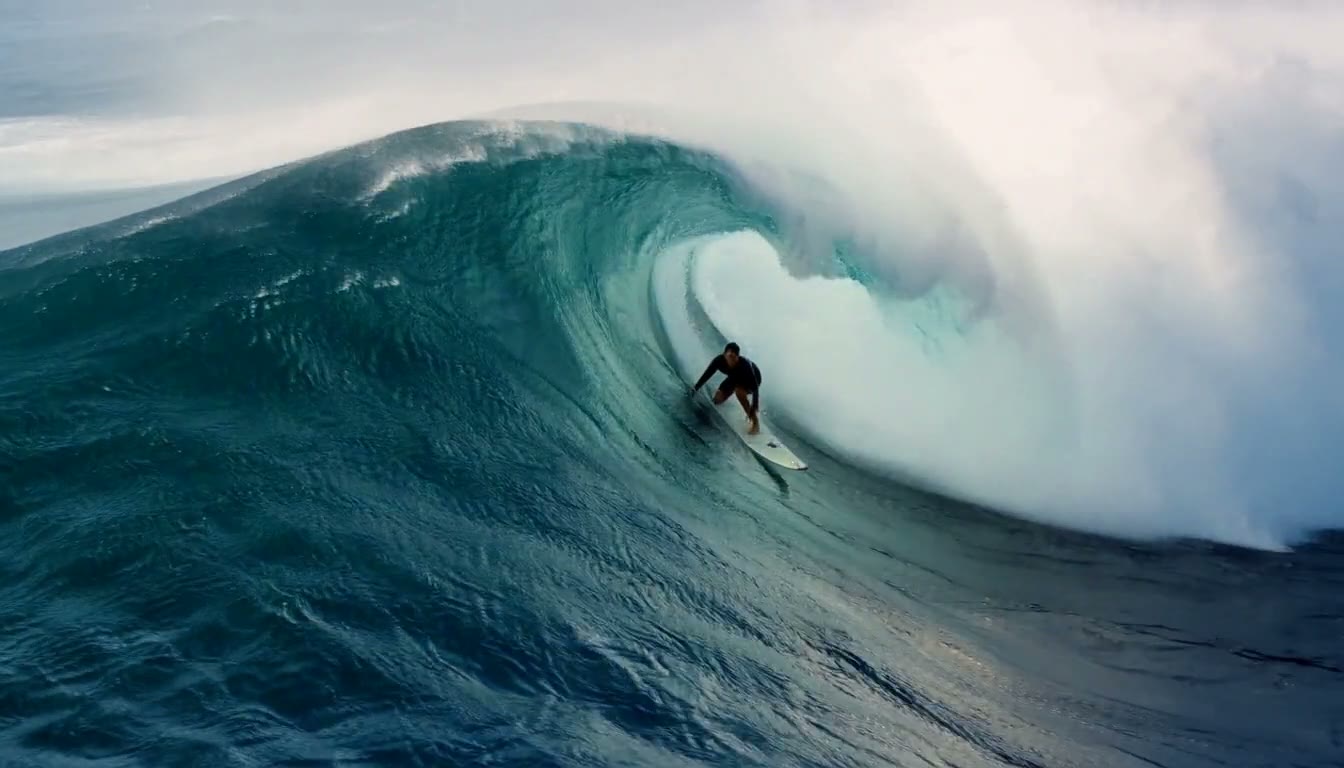 MiniMax H3 AI video example showing a surfer rides a powerful wave, carving through the barrel with precision